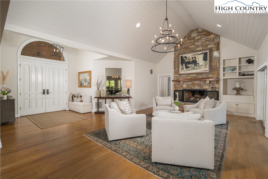 1005 Evergreen Drive Boone, NC 28607 - Photo 12 of 44 a living room with fireplace furniture and a chandelier