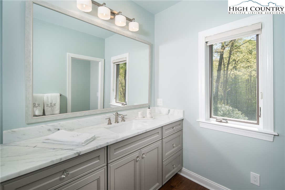 1005 Evergreen Drive Boone, NC 28607 - Photo 17 of 44 a bathroom with a sink and a mirror