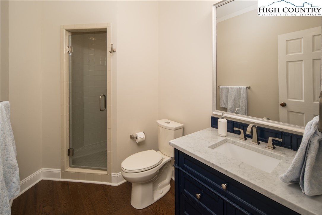 1005 Evergreen Drive Boone, NC 28607 - Photo 19 of 44 a bathroom with a granite countertop toilet sink and mirror
