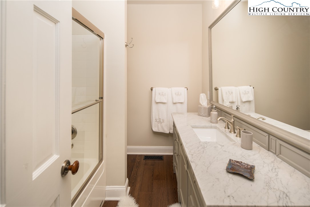 1005 Evergreen Drive Boone, NC 28607 - Photo 21 of 44 a bathroom with a granite countertop sink and a mirror