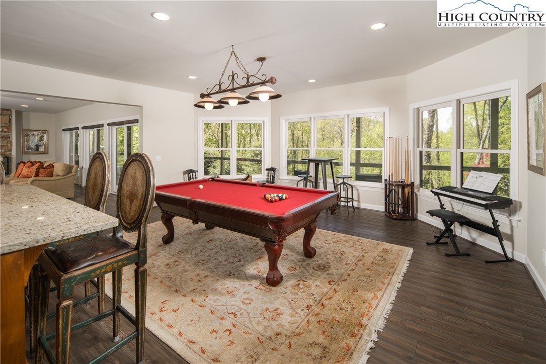 1005 Evergreen Drive Boone, NC 28607 - Photo 24 of 44 a living room with furniture pool table wooden floor and windows