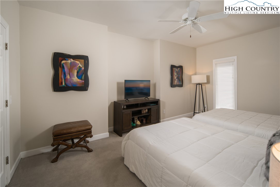 1005 Evergreen Drive Boone, NC 28607 - Photo 32 of 44 a bedroom with a bed and a chair