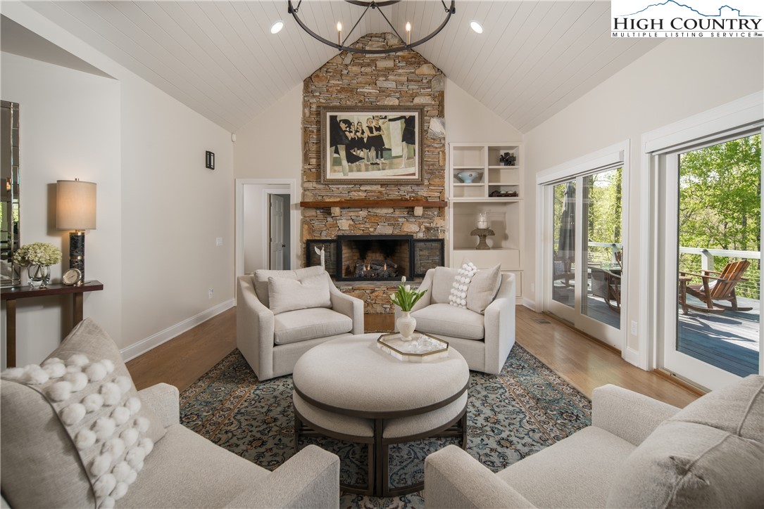 1005 Evergreen Drive Boone, NC 28607 - Photo 5 of 44 a living room with furniture a fireplace and a table