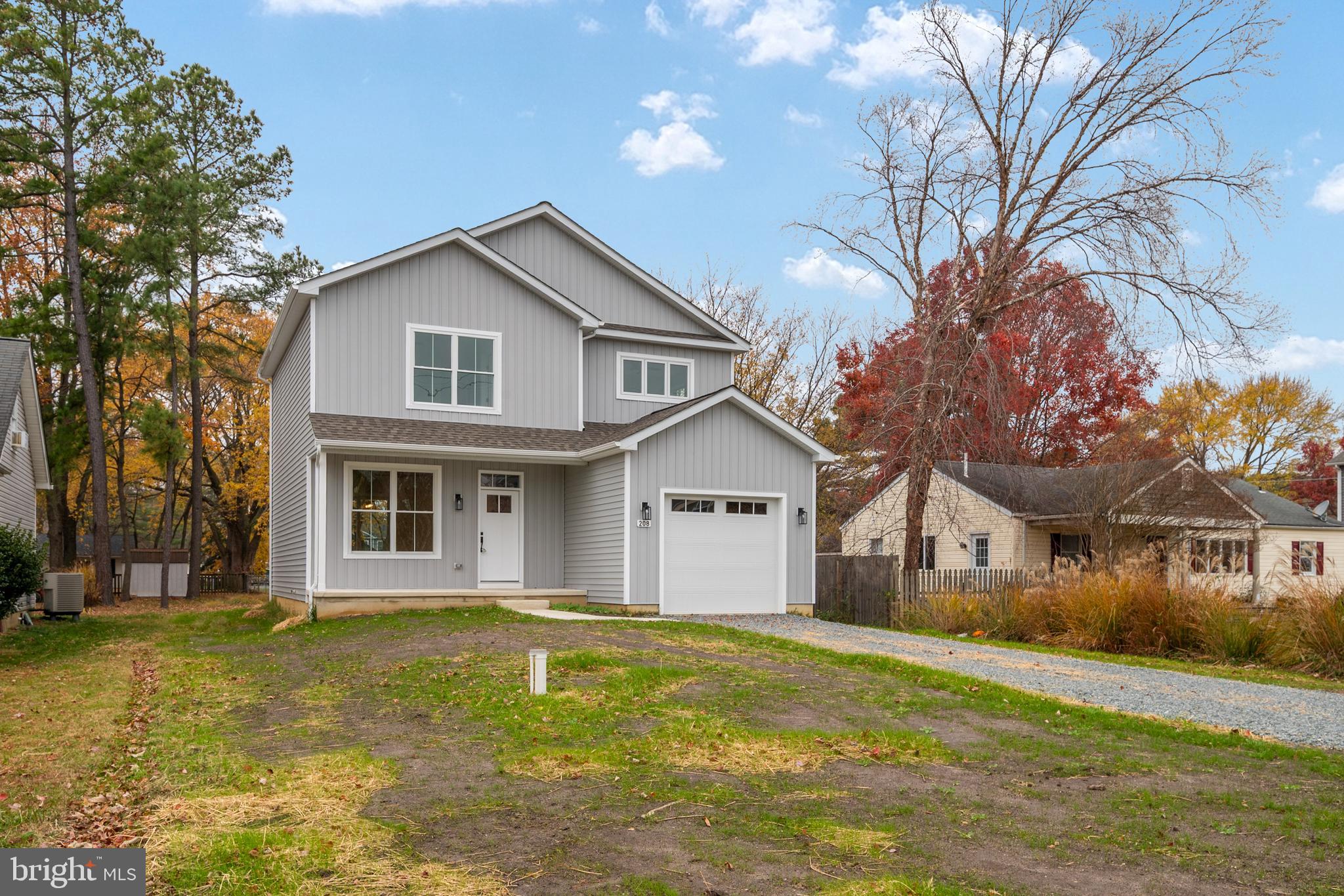 208 Long Point Road Stevensville, MD 21666 - Photo 17 of 52 a front view of a house with garden