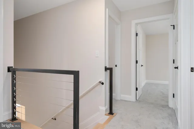 an empty room with chandelier fan