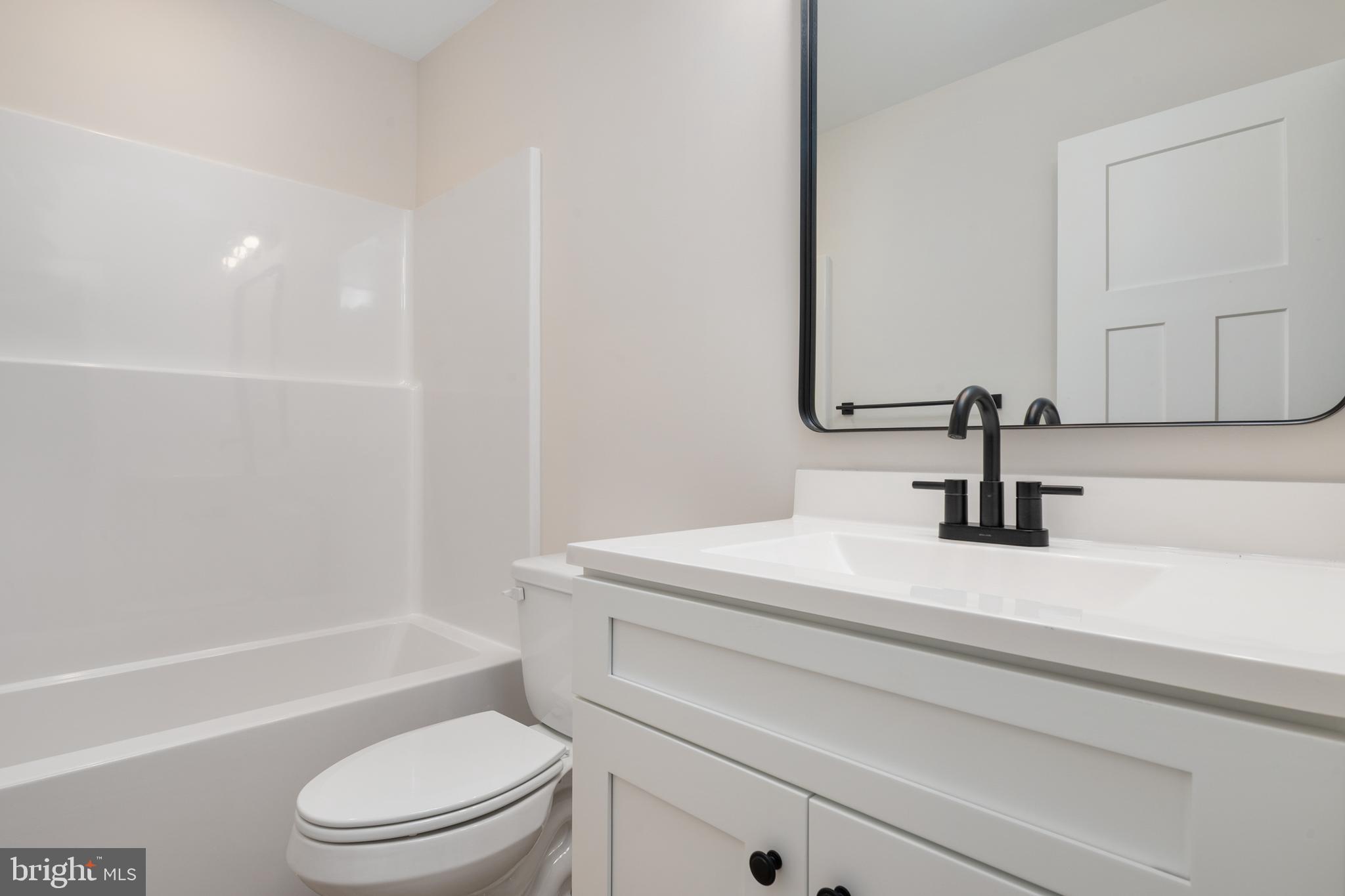 208 Long Point Road Stevensville, MD 21666 - Photo 27 of 52 a bathroom with a sink a toilet and a bathtub