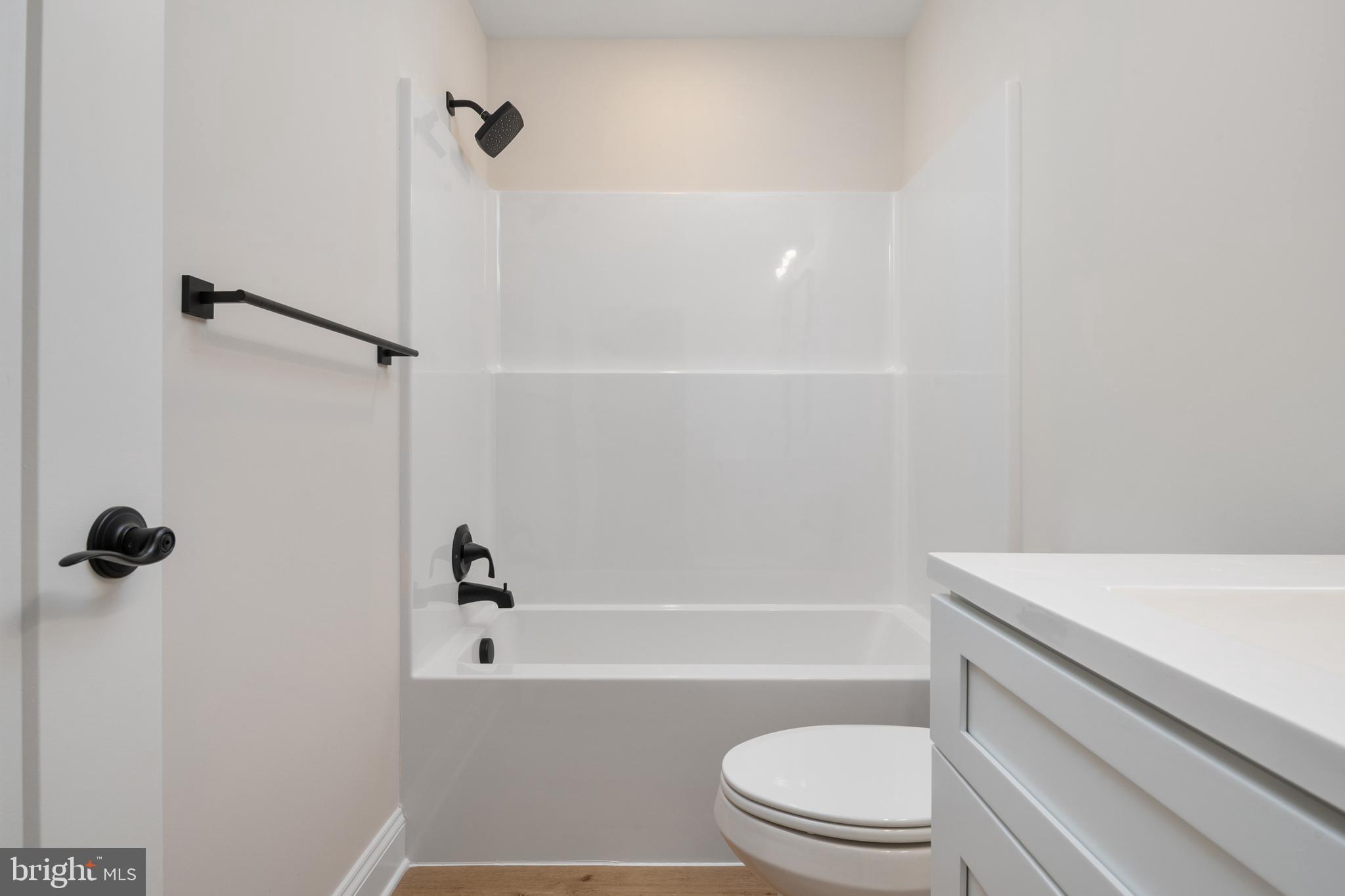 208 Long Point Road Stevensville, MD 21666 - Photo 28 of 52 a bathroom with a sink a toilet and a bathtub