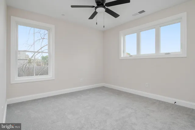 a view of storage and utility room with wooden floor