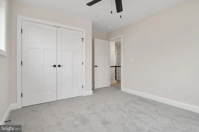 an aerial view of a house with yard