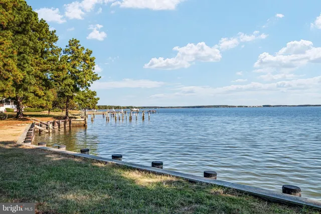 a view of a house with garden and sitting area