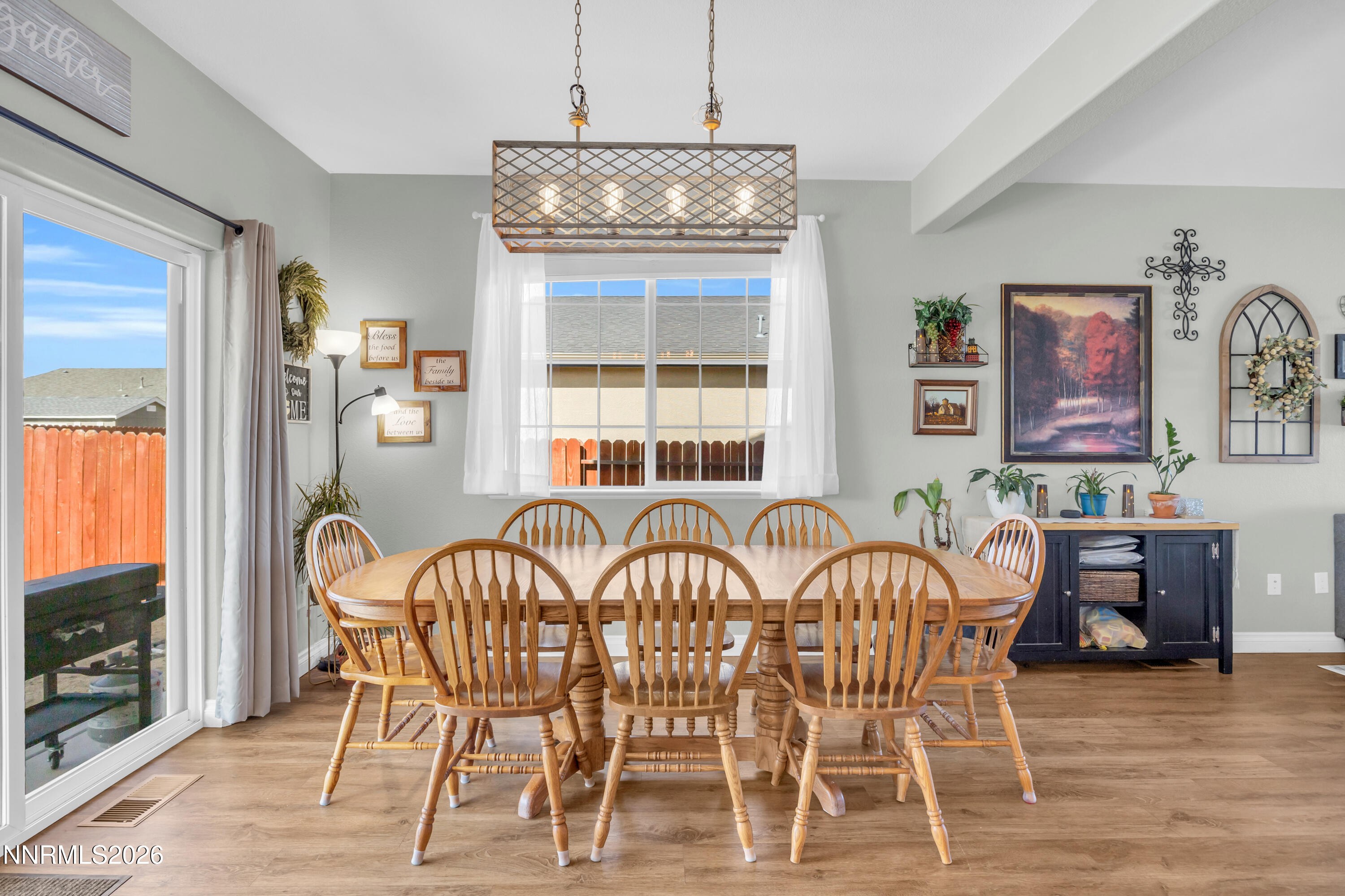 18648 Granite Peak Court Reno, NV 89508 - Photo 11 of 53 a view of a dining room with furniture wooden floor and chandelier