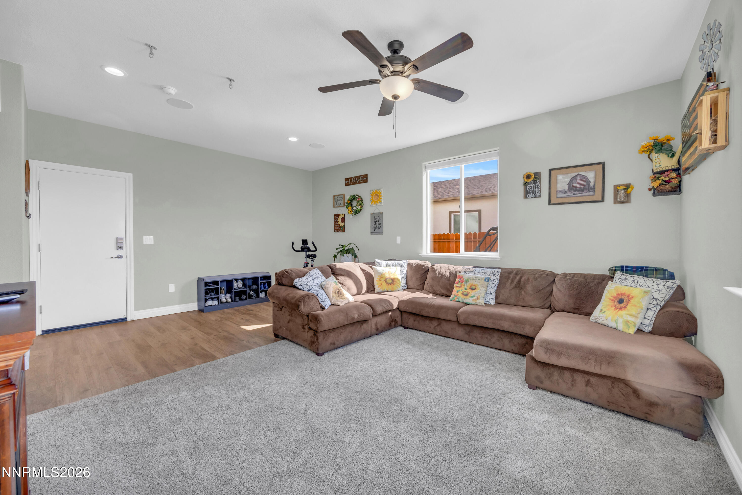 18648 Granite Peak Court Reno, NV 89508 - Photo 18 of 53 a living room with furniture and a large window