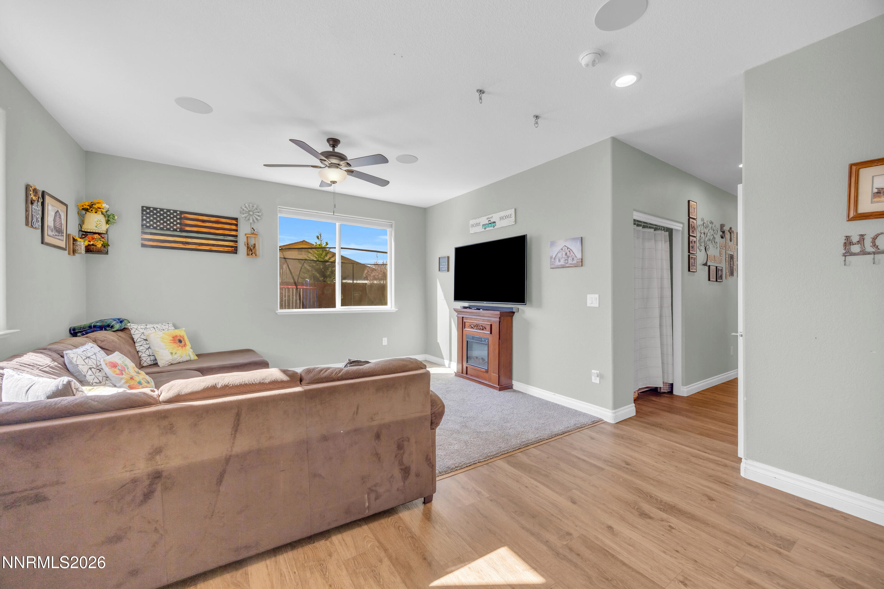 18648 Granite Peak Court Reno, NV 89508 - Photo 19 of 53 a living room with furniture and a flat screen tv