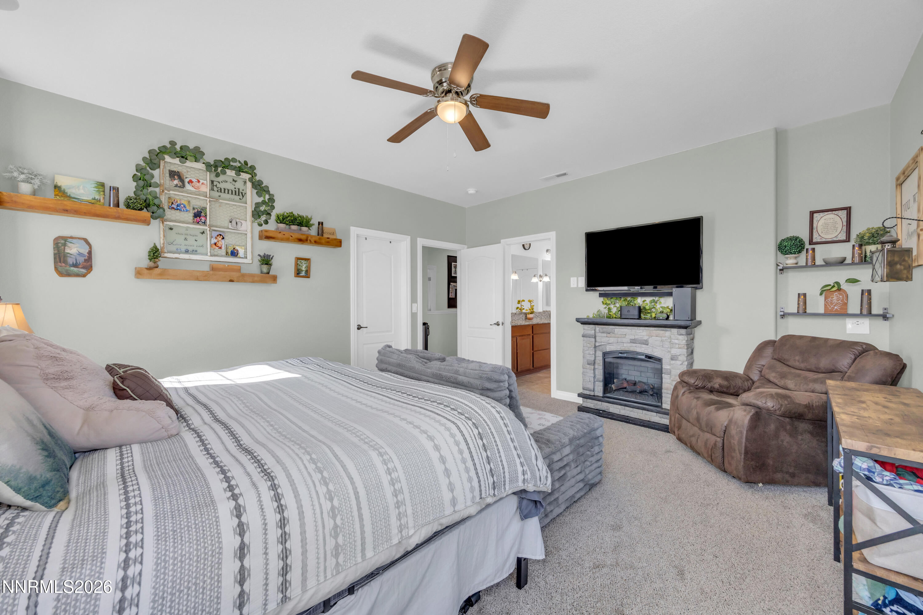 18648 Granite Peak Court Reno, NV 89508 - Photo 21 of 53 a bedroom with a bed and a flat screen tv
