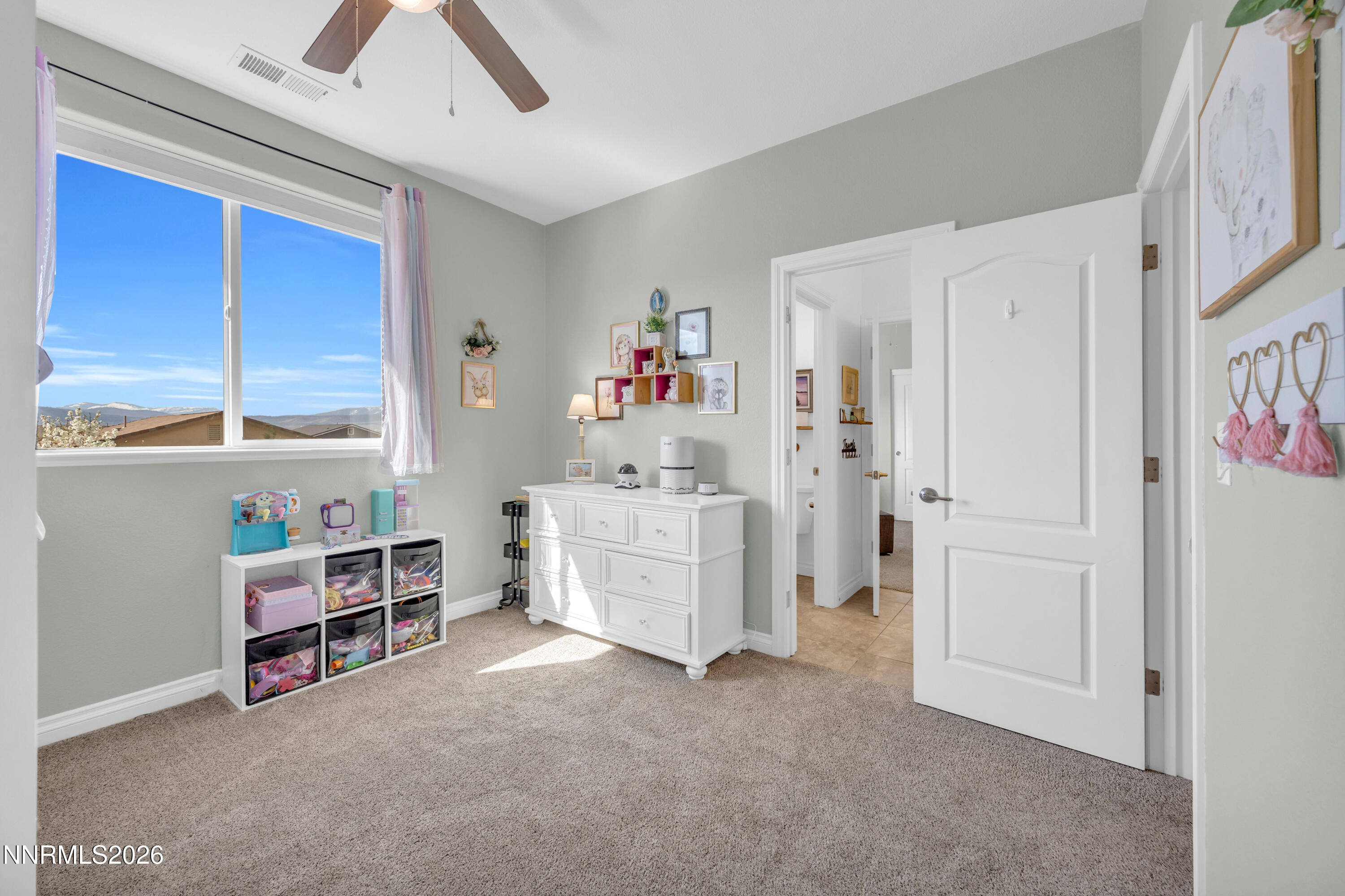 18648 Granite Peak Court Reno, NV 89508 - Photo 29 of 53 a room with furniture and a window