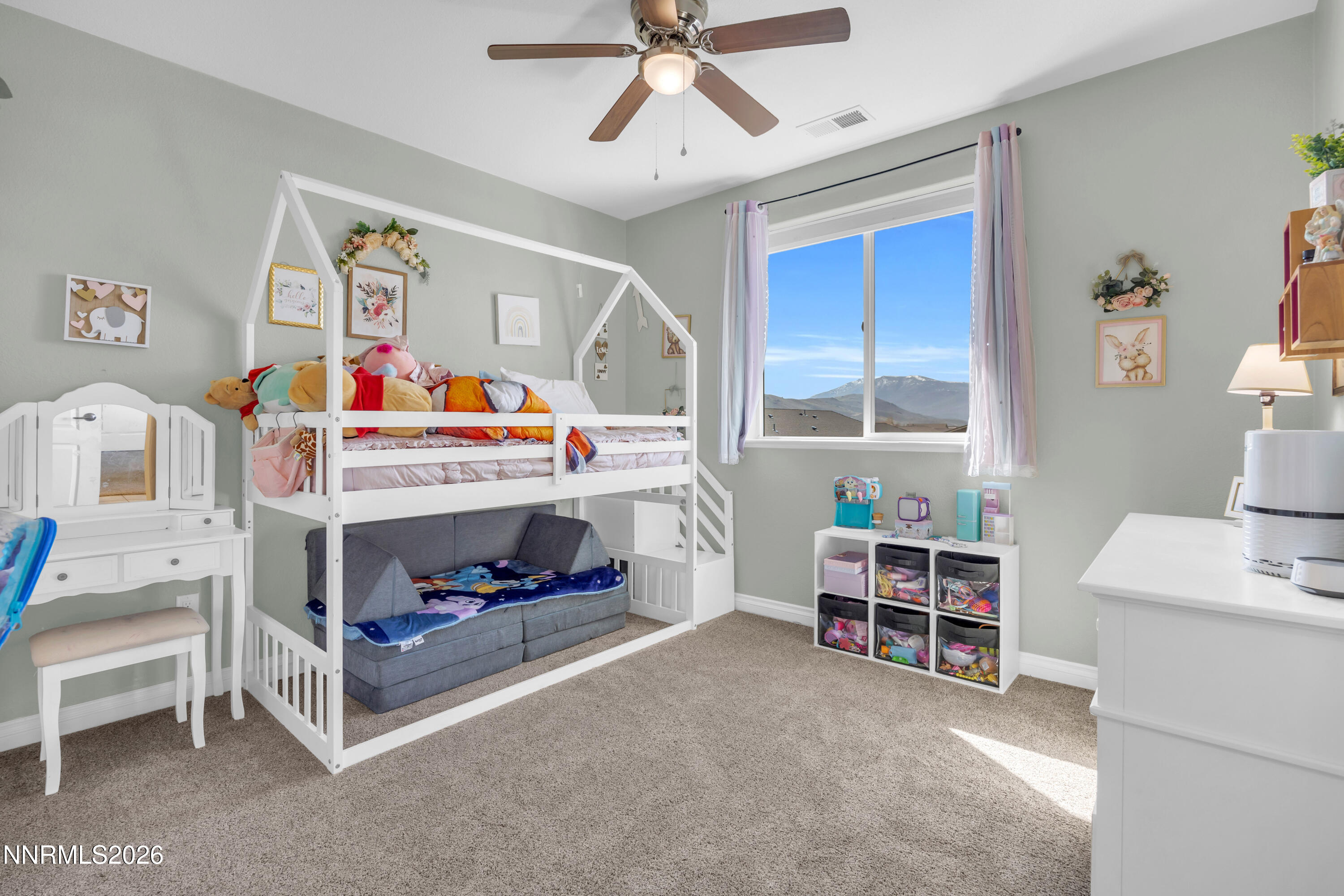 18648 Granite Peak Court Reno, NV 89508 - Photo 30 of 53 a bedroom with furniture and a baby bed