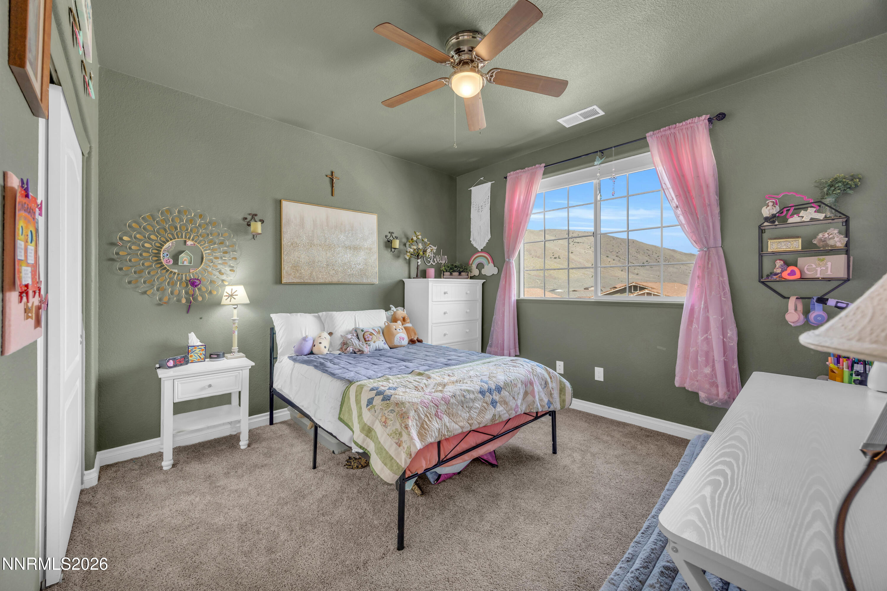 18648 Granite Peak Court Reno, NV 89508 - Photo 34 of 53 a bedroom with a bed and a large window