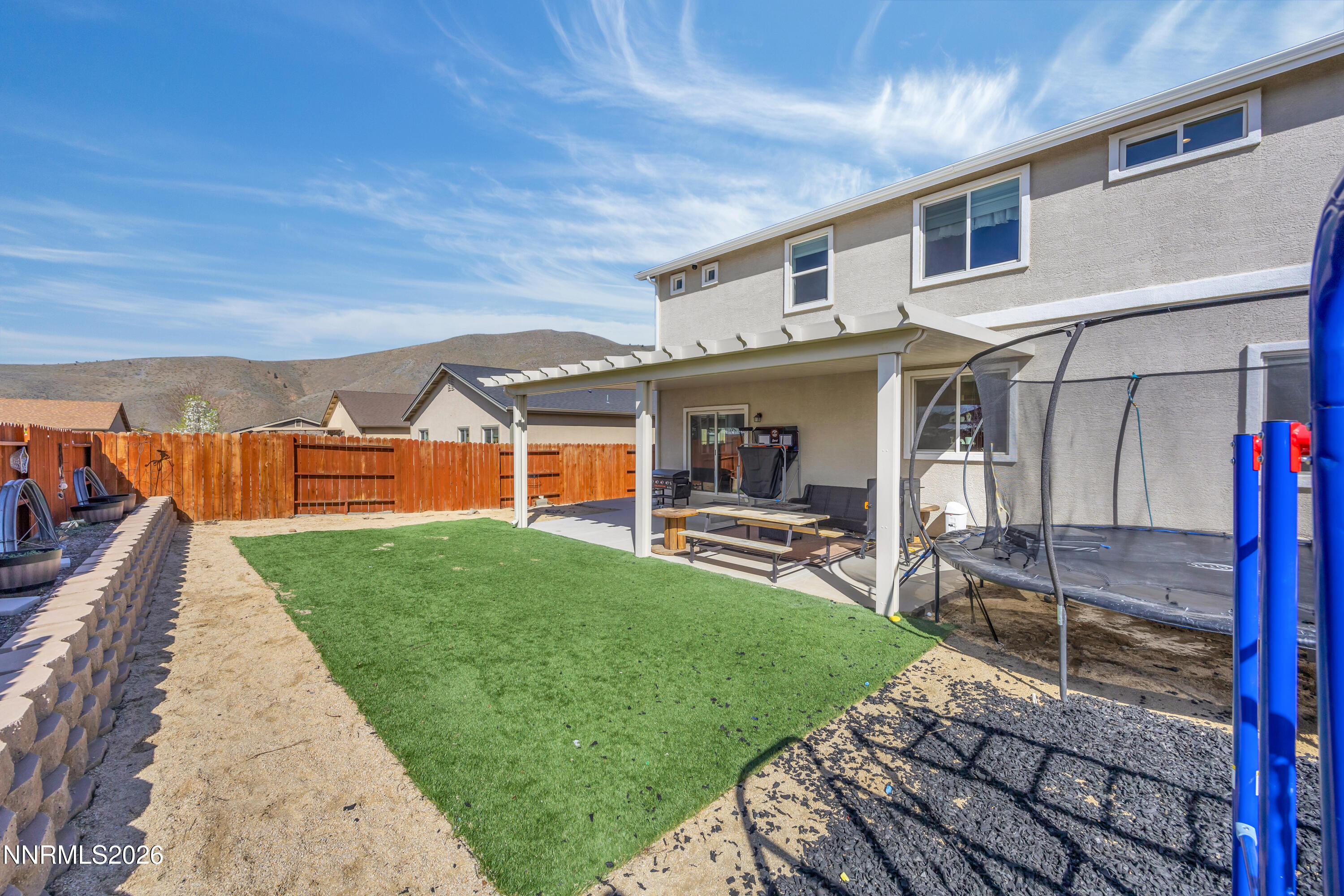 18648 Granite Peak Court Reno, NV 89508 - Photo 41 of 53 a view of a house with backyard and porch