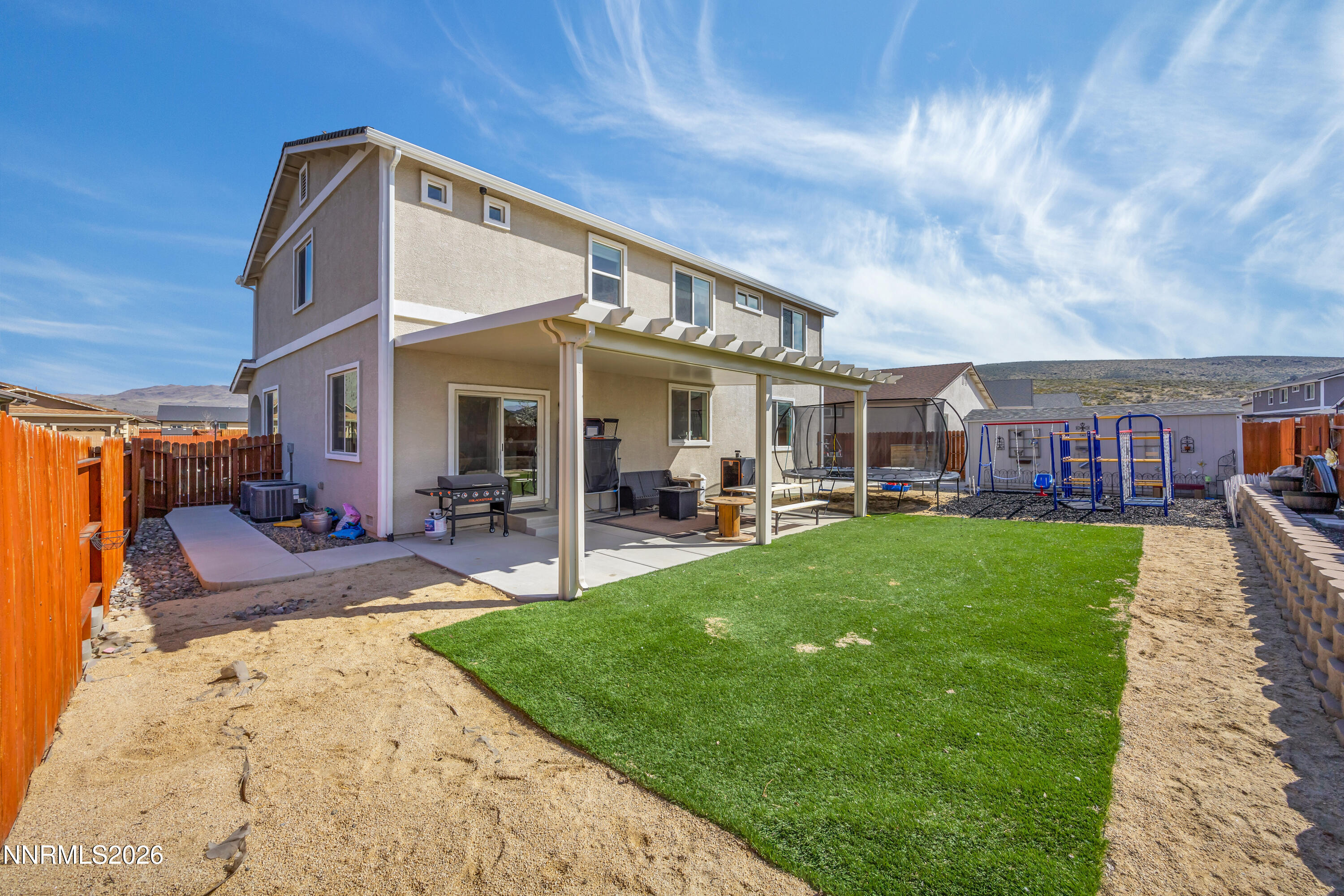 18648 Granite Peak Court Reno, NV 89508 - Photo 42 of 53 a view of a big yard next to a building