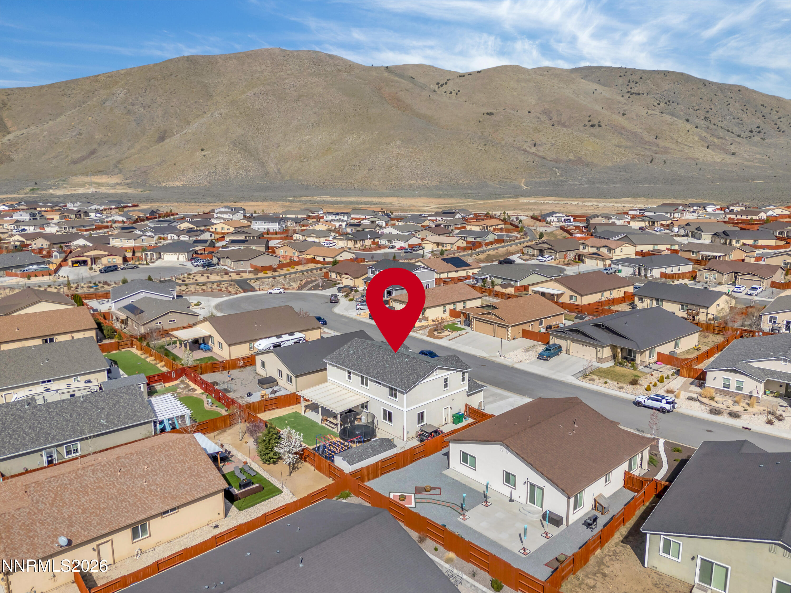 18648 Granite Peak Court Reno, NV 89508 - Photo 44 of 53 an aerial view of a house with a mountain