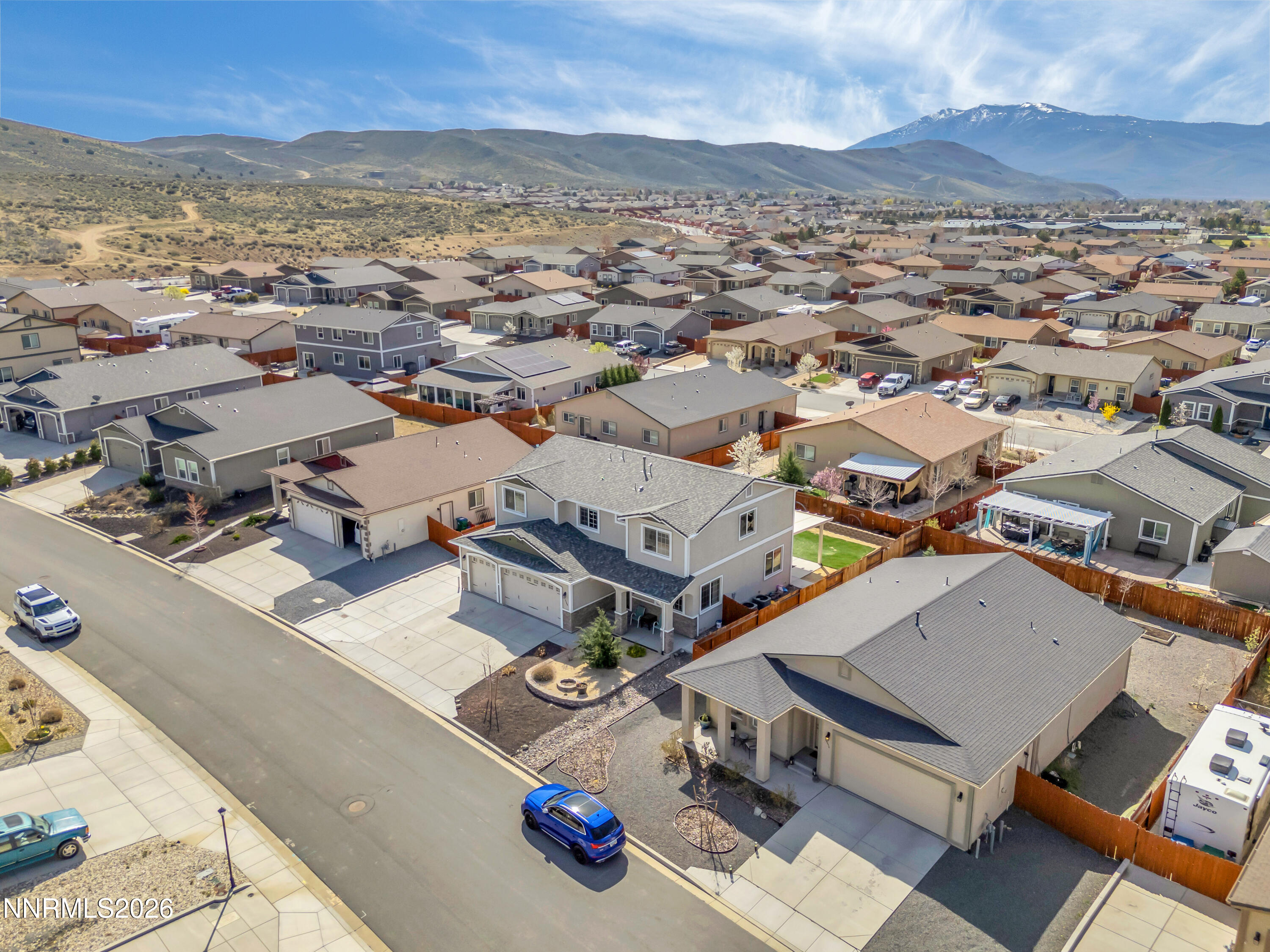 18648 Granite Peak Court Reno, NV 89508 - Photo 51 of 53 an aerial view of a city with lots of residential buildings and mountain view in back