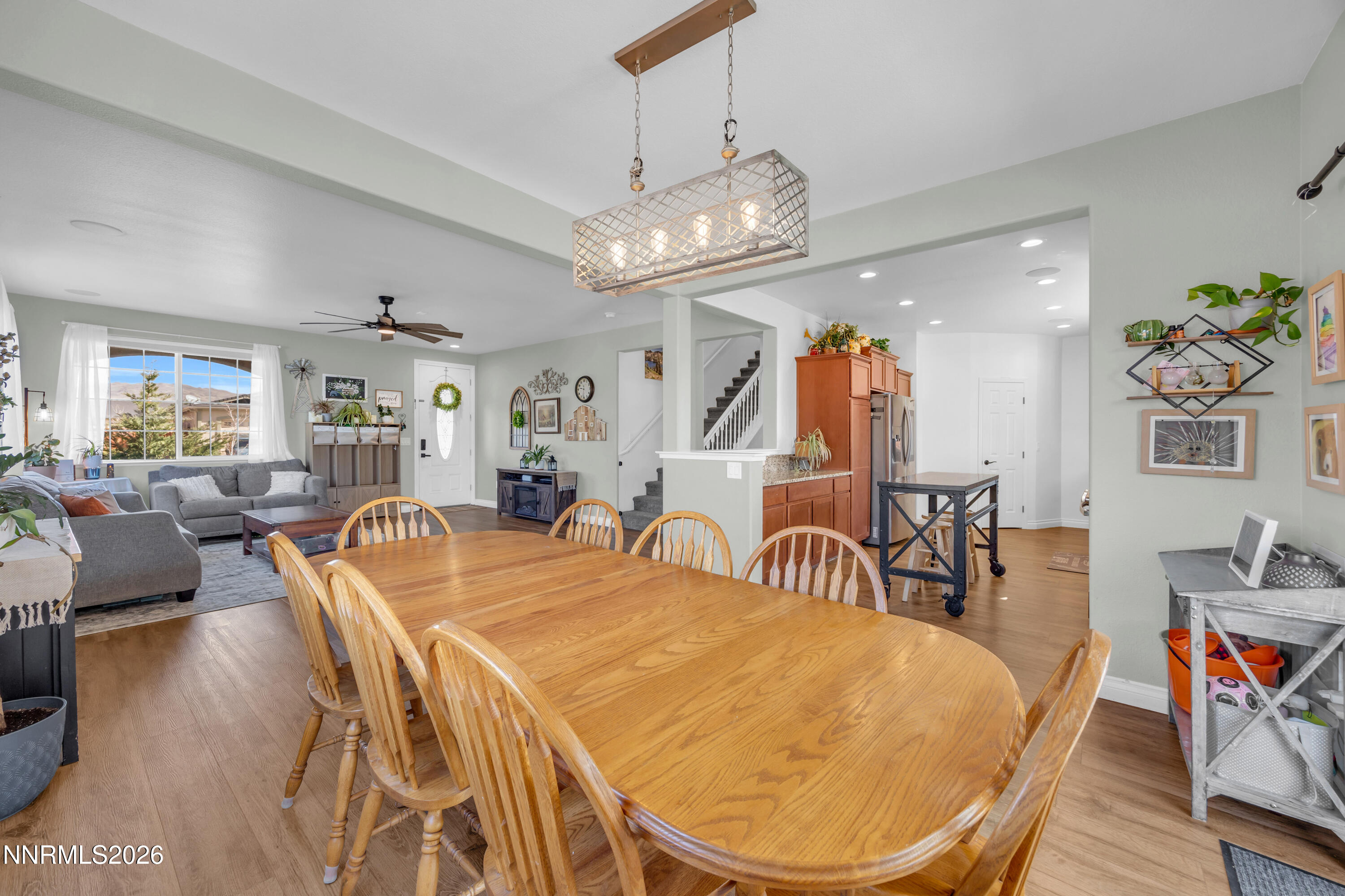 18648 Granite Peak Court Reno, NV 89508 - Photo 10 of 53 a view of a dining room with furniture and wooden floor