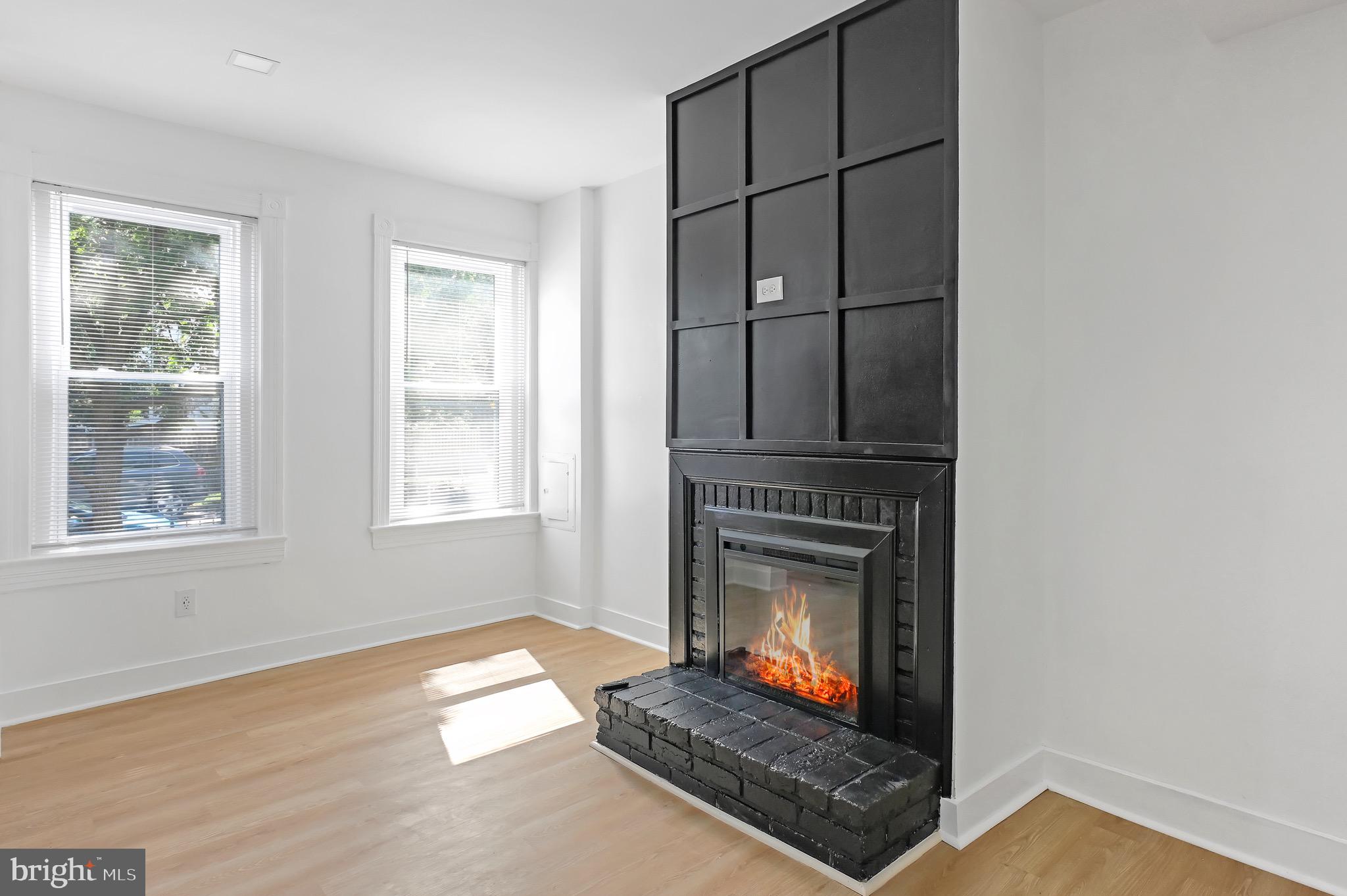1702 A Street Southeast Washington, DC 20003 - Photo 5 of 24 a living room with fireplace furniture and a window