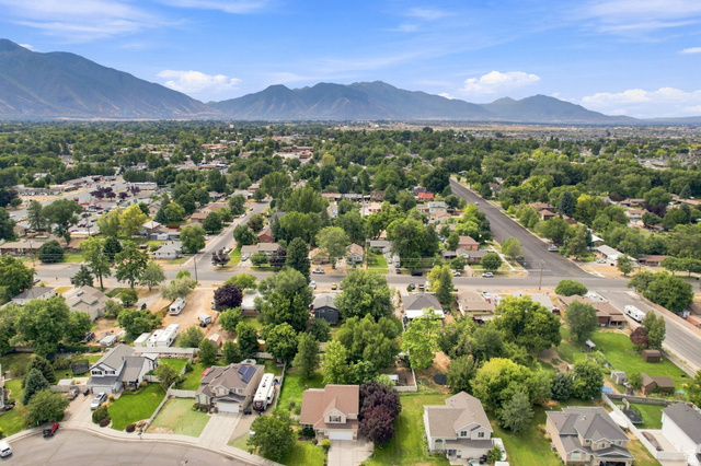 154 West 400 North Springville, UT 84663 - Photo 37 of 43 Expansive mountain backdrop with a residential area featuring mature trees and established streets