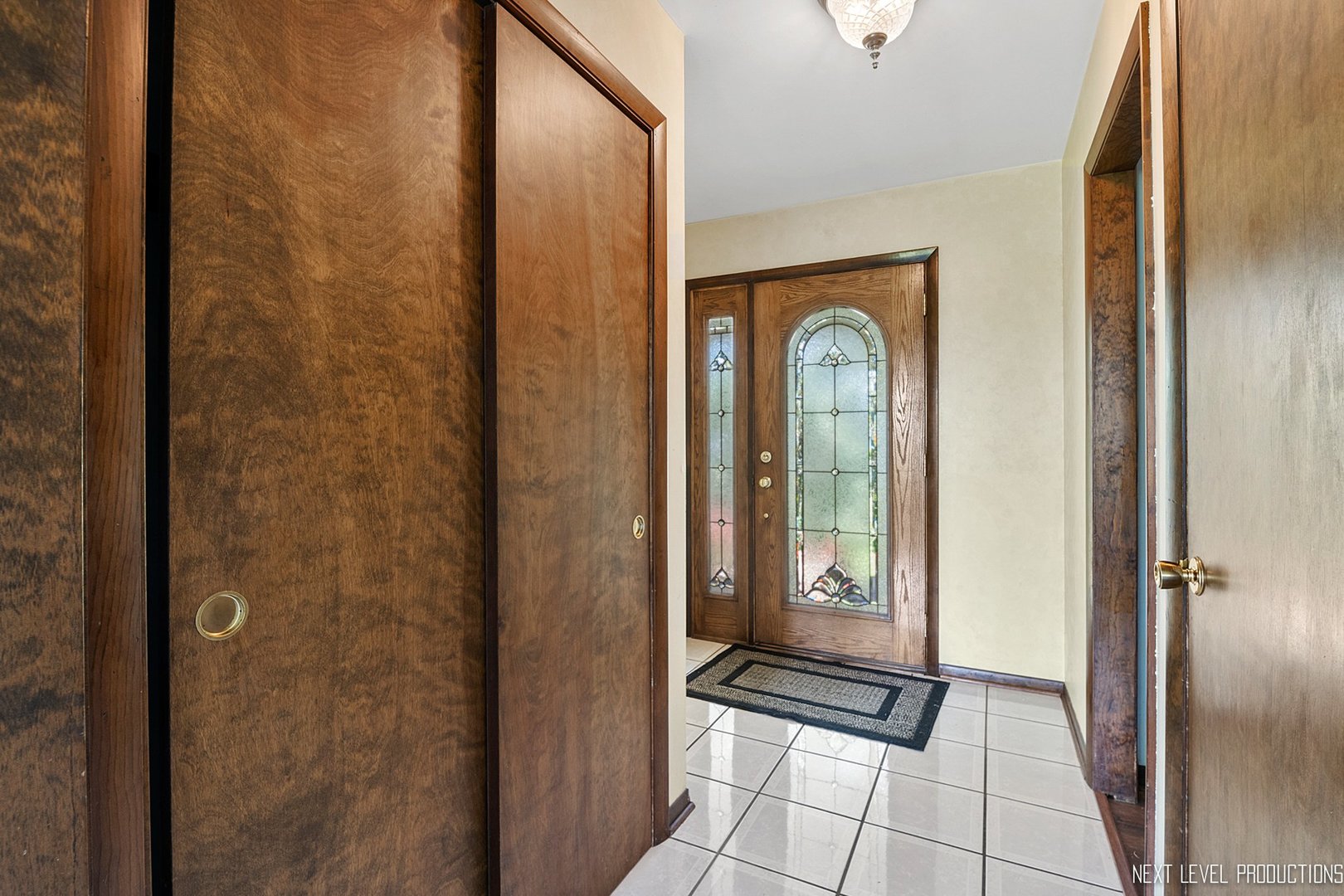 14900 Sears Road Plano, IL 60545 - Photo 8 of 31 a view of a hallway with wooden floor windows and entryway