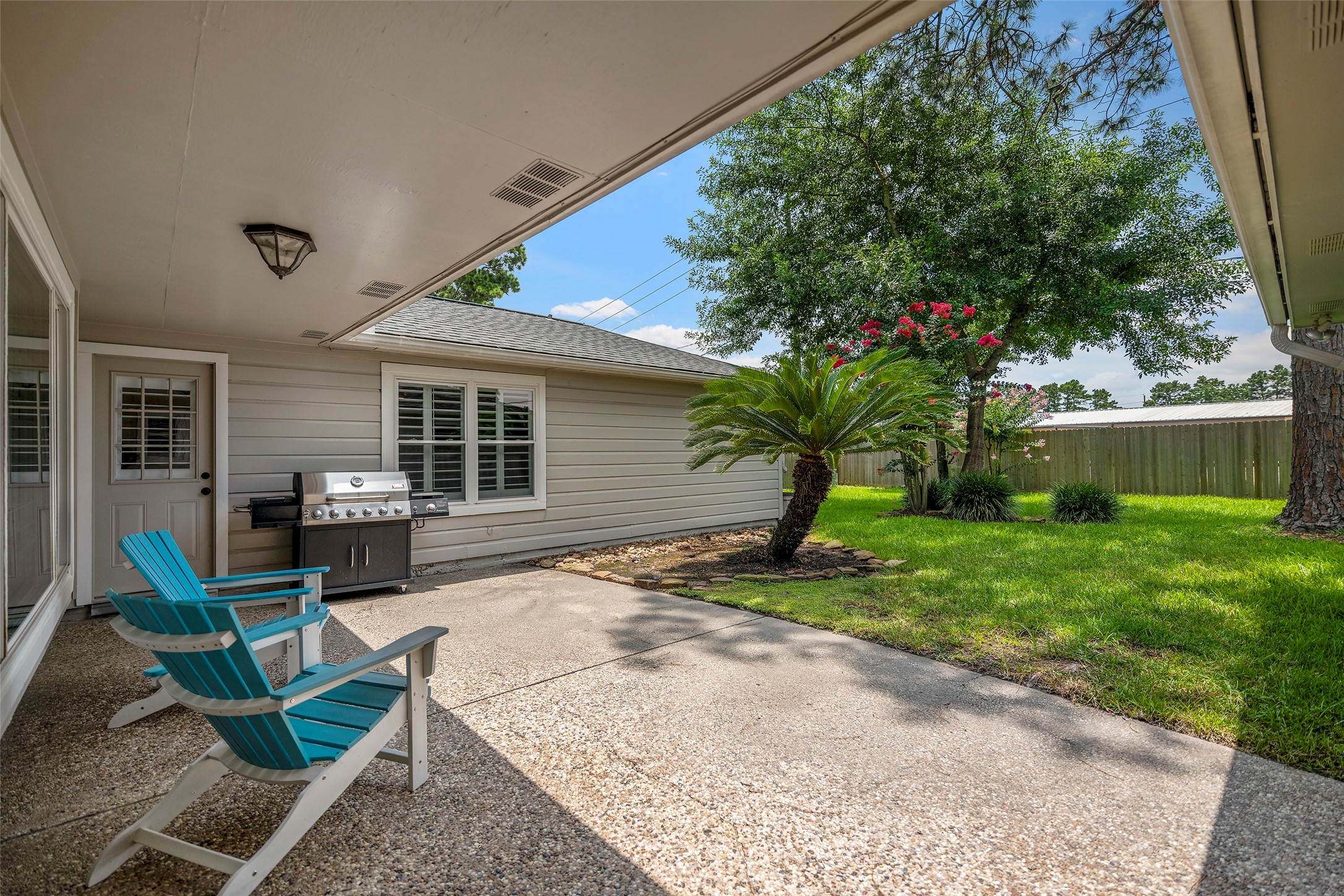 6507 Allentown Drive Spring, TX 77389 - Photo 22 of 30 A stunning private patio featuring a pebble extended area, a thick lush lawn, beautiful landscaping, and no rear neighbors.