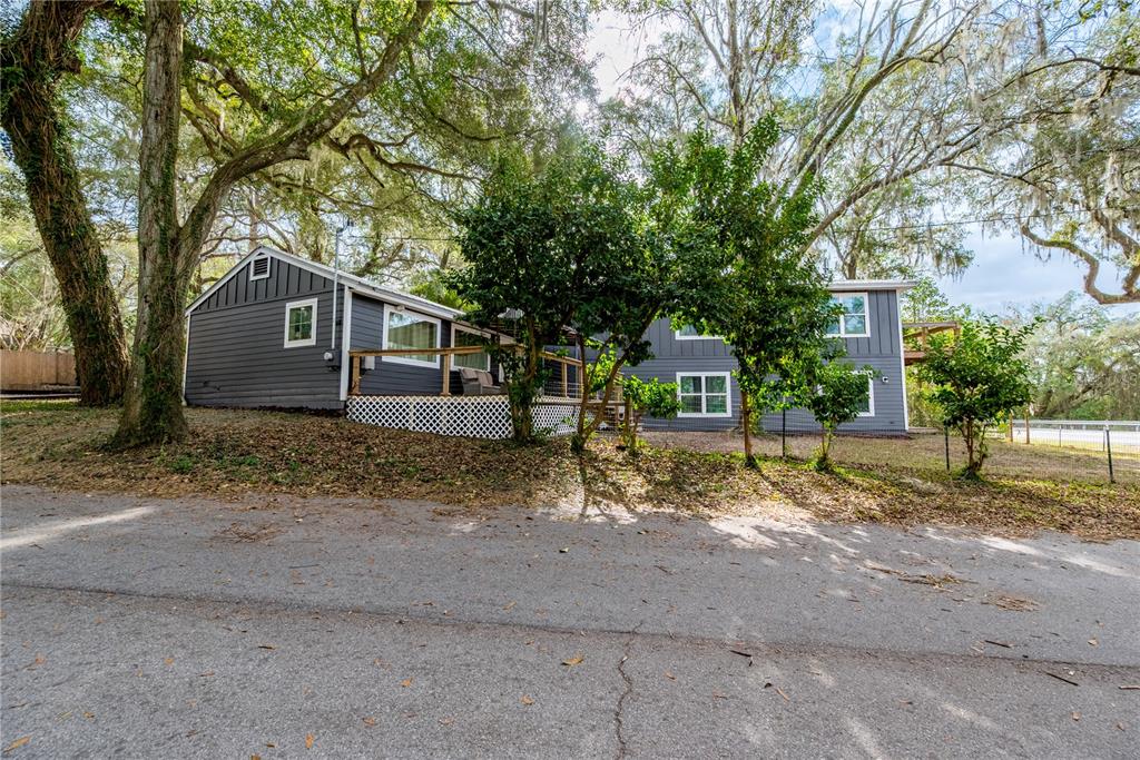 1353 Chatauqua Way Keystone Heights, FL 32656 - Photo 2 of 60 a view of a house with a tree in front of it