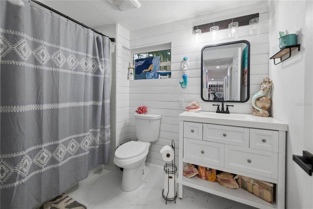 1353 Chatauqua Way Keystone Heights, FL 32656 - Photo 25 of 60 a bathroom with a sink toilet and shower