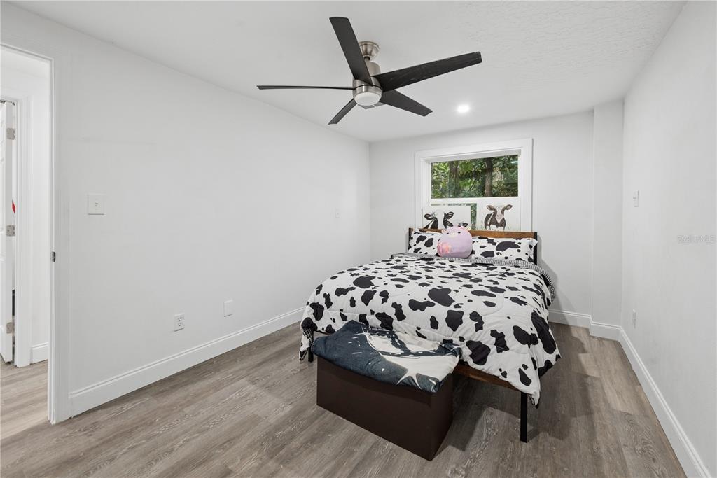 1353 Chatauqua Way Keystone Heights, FL 32656 - Photo 29 of 60 a bedroom with a large bed and a window