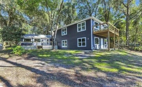 1353 Chatauqua Way Keystone Heights, FL 32656 - Photo 3 of 60 a front view of a house with a yard