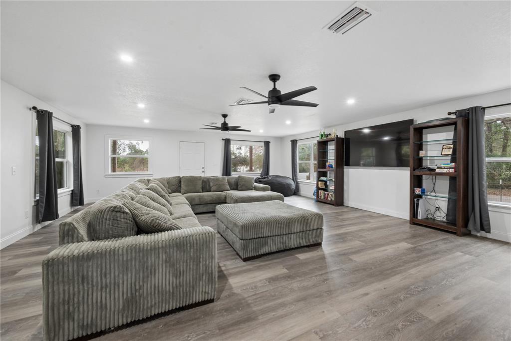 1353 Chatauqua Way Keystone Heights, FL 32656 - Photo 31 of 60 a living room with furniture and wooden floor