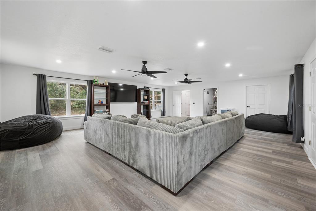 1353 Chatauqua Way Keystone Heights, FL 32656 - Photo 33 of 60 a living room with furniture and a large window