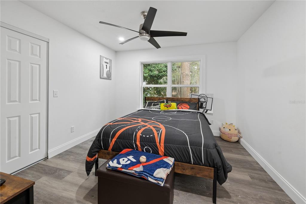 1353 Chatauqua Way Keystone Heights, FL 32656 - Photo 41 of 60 a bedroom with a bed and a window