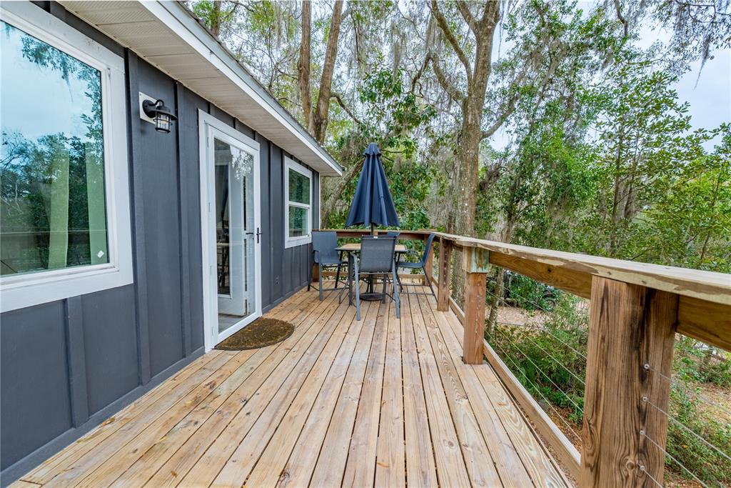 1353 Chatauqua Way Keystone Heights, FL 32656 - Photo 44 of 60 a view of balcony with furniture and wooden floor