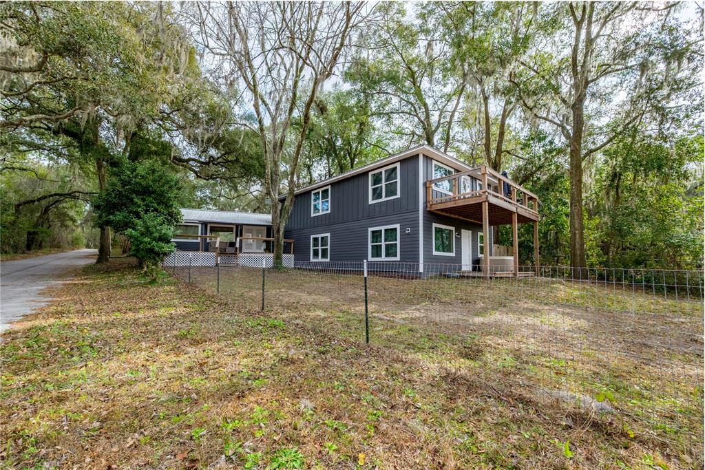 1353 Chatauqua Way Keystone Heights, FL 32656 - Photo 5 of 60 a view of a house with a yard