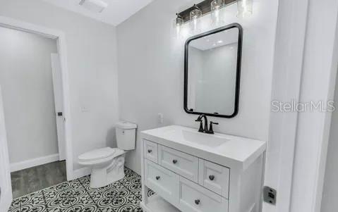 1353 Chatauqua Way Keystone Heights, FL 32656 - Photo 52 of 60 a bathroom with a sink toilet and mirror