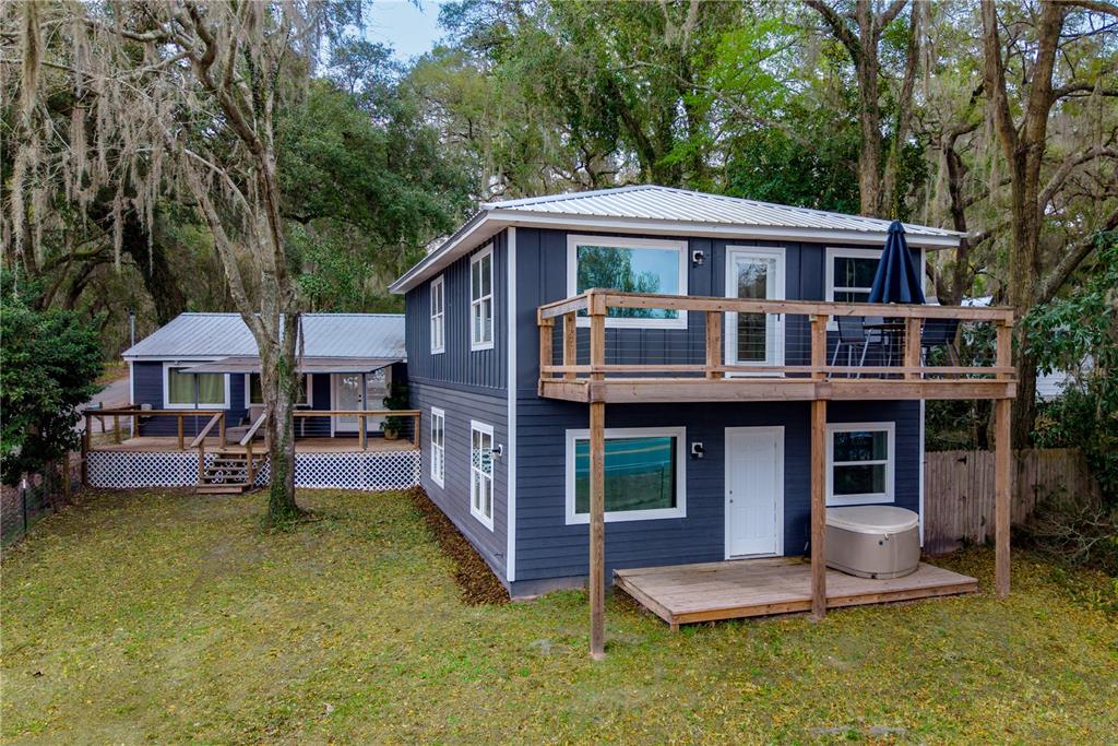 1353 Chatauqua Way Keystone Heights, FL 32656 - Photo 60 of 60 a front view of a house with a yard table and chairs