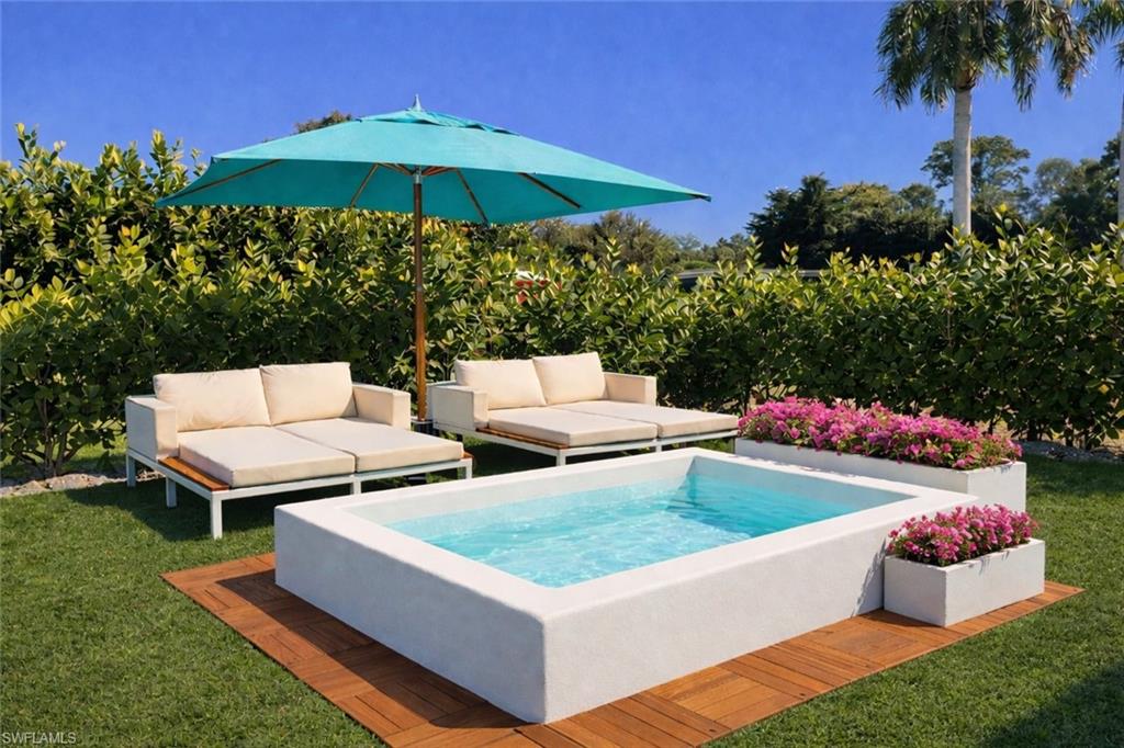a view of a patio with chairs and a small yard