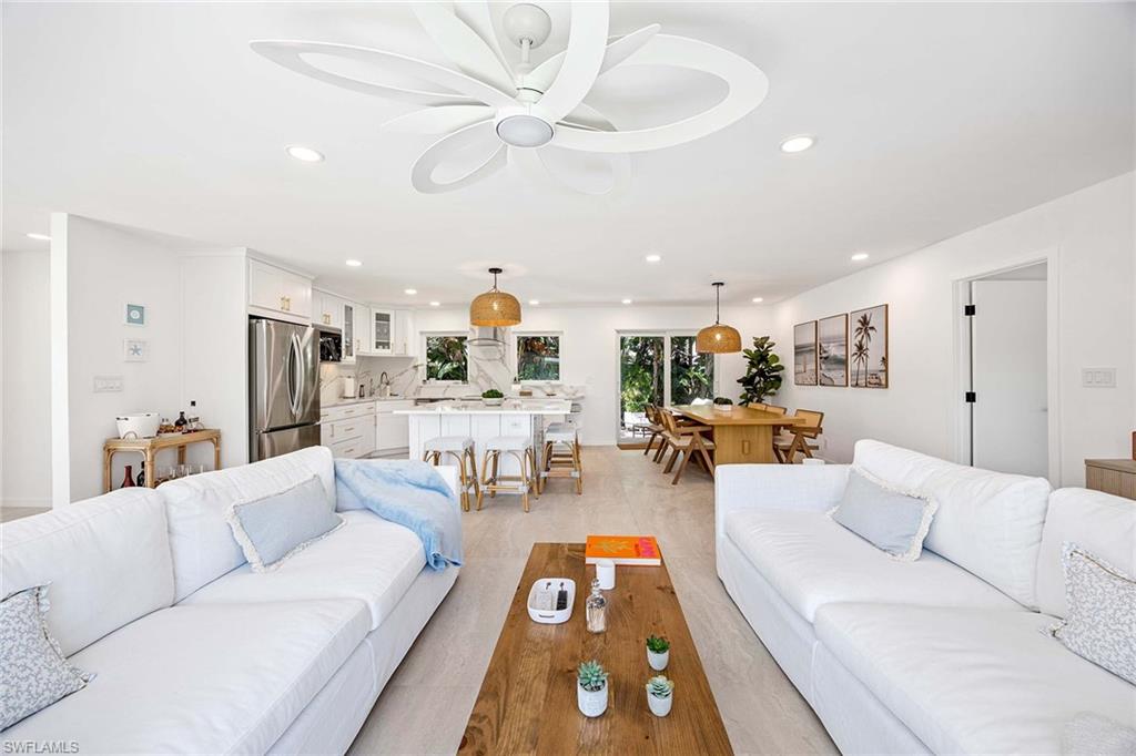24 Rivard Road Naples, FL 34112 - Photo 11 of 29 a living room with furniture and kitchen view
