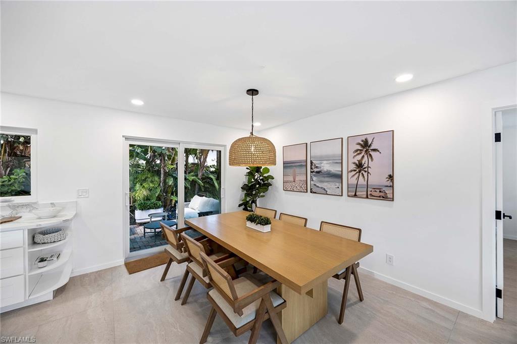 24 Rivard Road Naples, FL 34112 - Photo 16 of 29 a view of a dining room with a table and chairs
