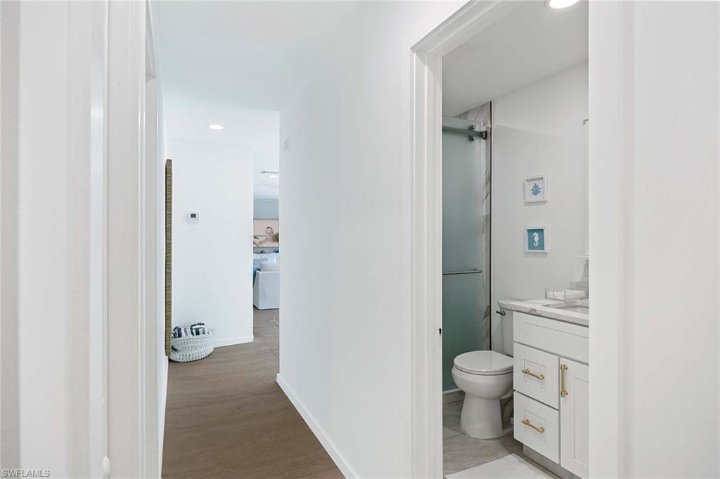 24 Rivard Road Naples, FL 34112 - Photo 23 of 29 a bathroom with a toilet and a shower