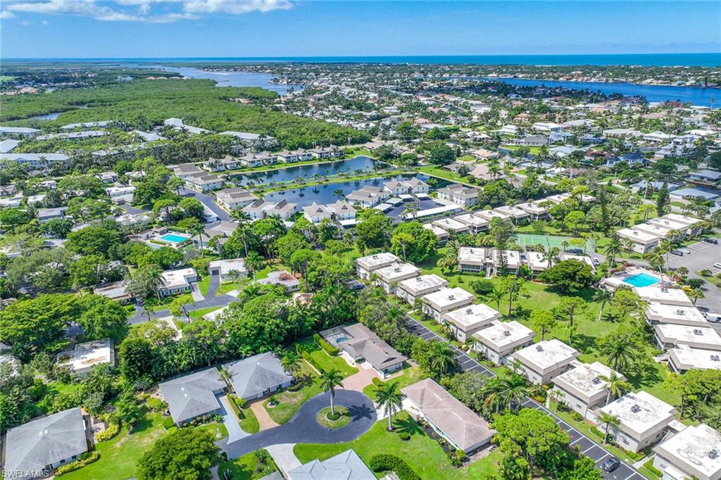 24 Rivard Road Naples, FL 34112 - Photo 29 of 29 an aerial view of residential houses with outdoor space and trees