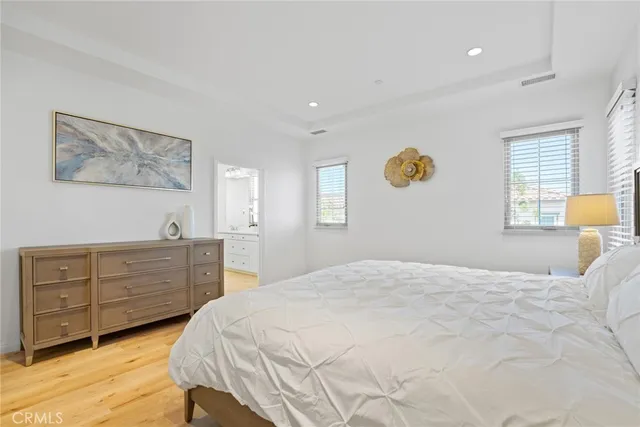 a bathroom with a granite countertop sink mirror and bathtub