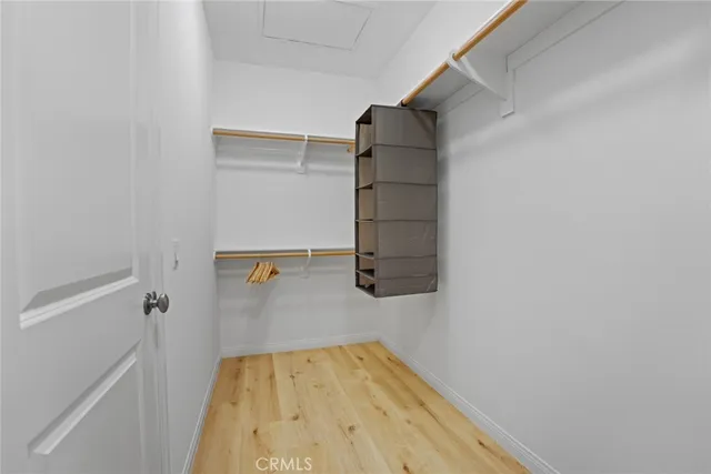 a bedroom with a bed and a windows