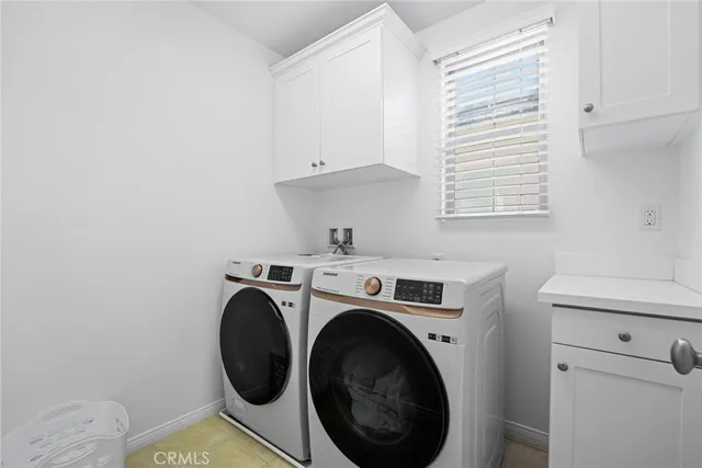 a room with furniture and a large window