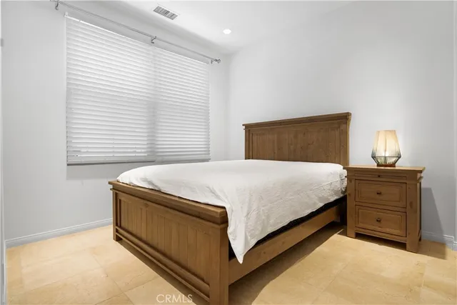 a bathroom with a shower sink vanity mirror and toilet
